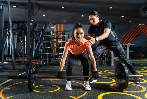 One-on-one personal training session with certified trainer at Recharge Bureau